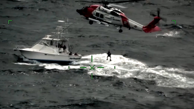 This image taken from a video shows a U.S. Coast Guard crew lifting a man to safety off Cape May, New Jersey. This SARSAT rescue was one of the 330 lives saved in 2021 aided by NOAA satellites.