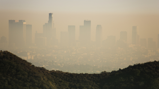 Air pollution in the form of brown smog envelops downtown Los Angeles, California. 2015. 