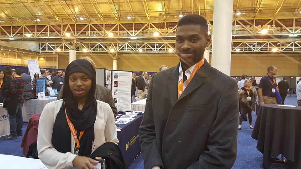 EPP/MSI Undergraduate Scholars Zainab Ali (North Carolina A&T University) and Samuel Oge (NOAA CREST; City College of the City University of New York) network during a poster session at the AMS Annual Meeting.