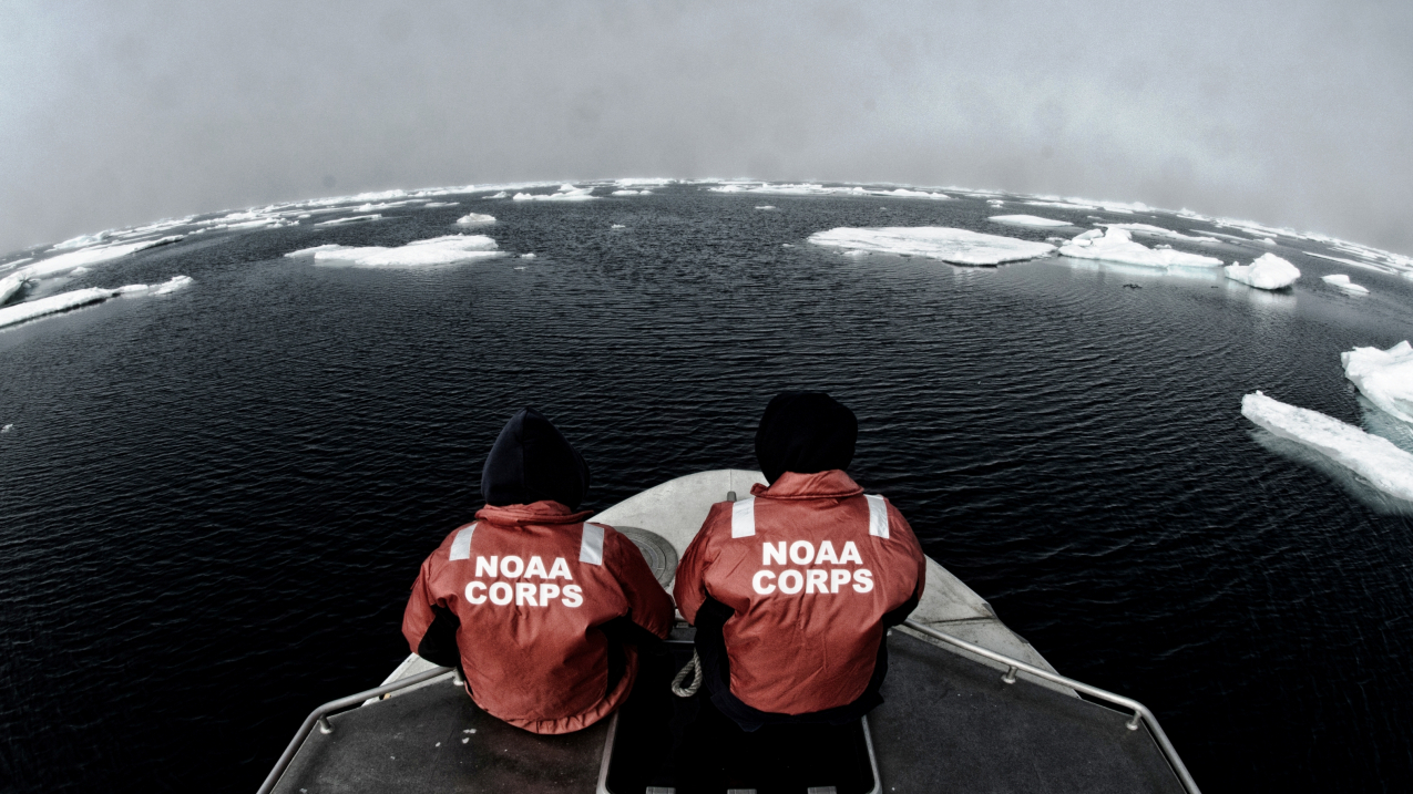 NOAA officers aboard one of the smaller survey vessels contemplate the vastness of the Chukchi Sea during the NOAA Ship Fairweather's reconnaissance survey in 2013. 