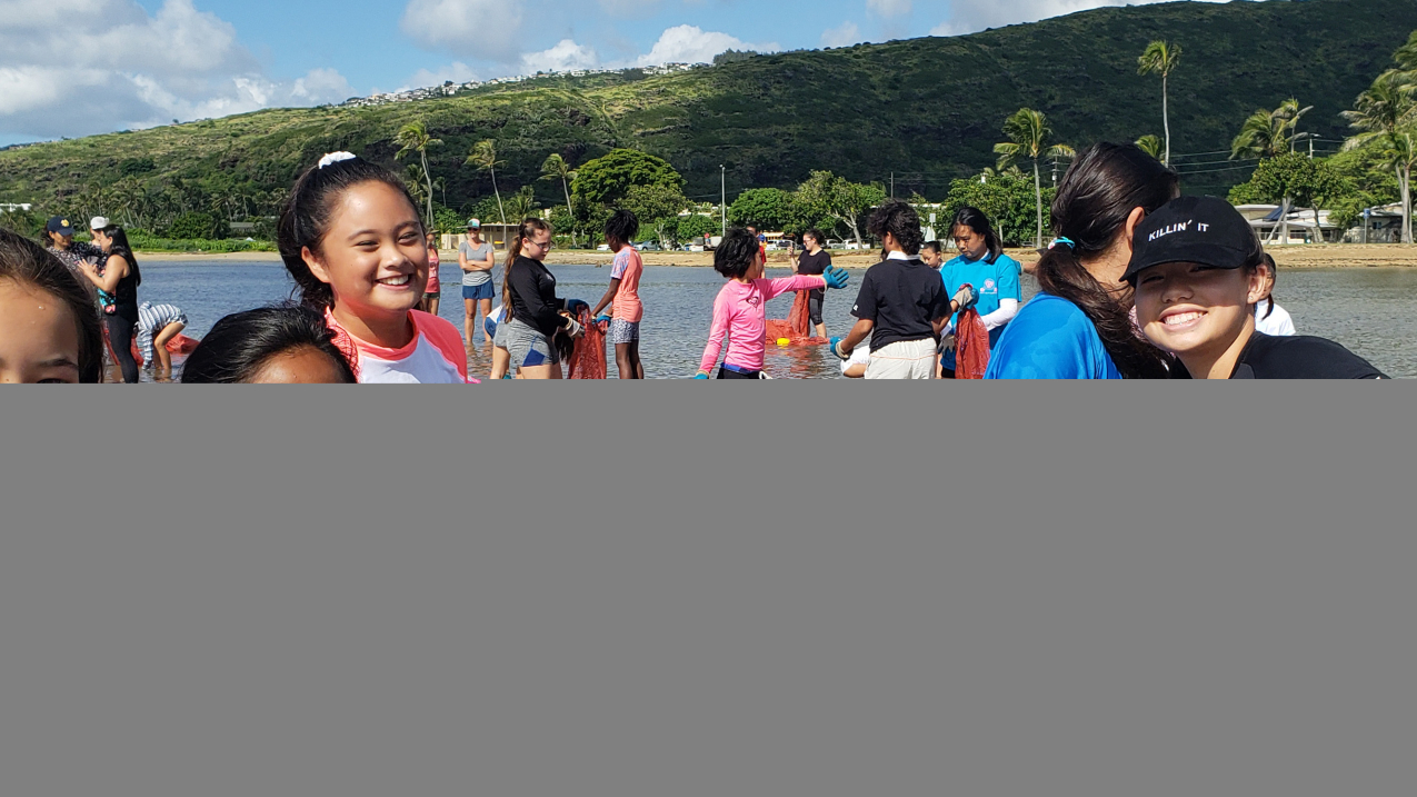 Armed with gloves and empty onion bags, Sacred Hearts Academy students are ready to pull some algae to improve the health of Maunalua Bay. The students removed over 1,200 pounds of harmful invasive algae during their 45-minute huki.