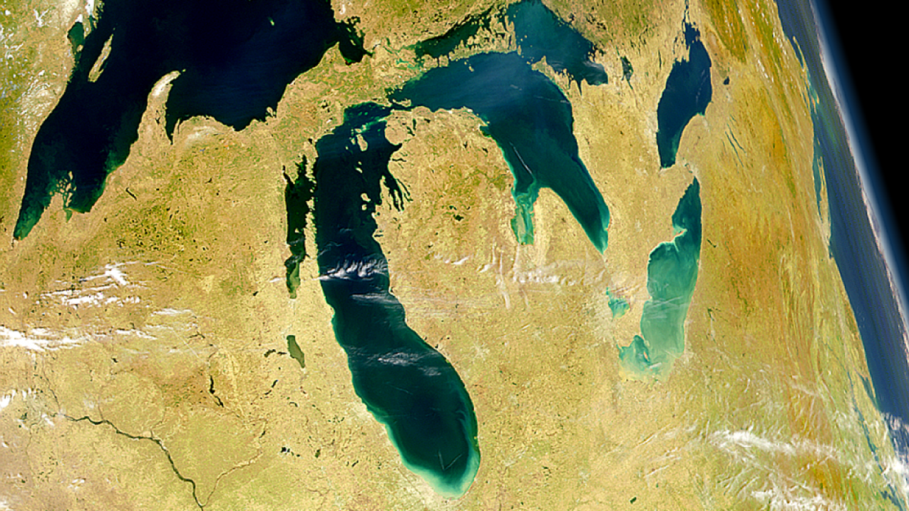A satellite image of the great lakes with little cloud cover.