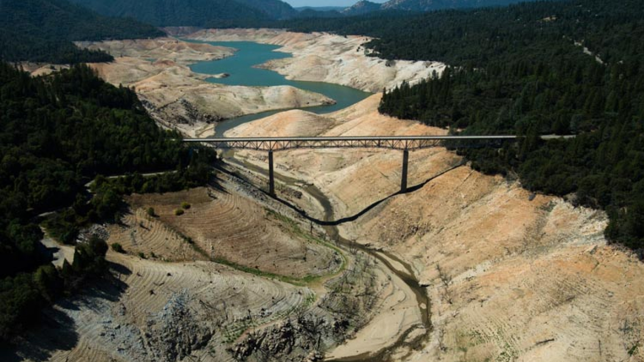 The Enterprise Bridge passes over a section of Lake Oroville that was nearly dry on September 30, 2014, in Oroville, California. Lake Oroville, California's 2nd largest reservoir, was at 49% of average (30% of capacity), the second lowest level on record (behind 1977.) Heavy rains in December 2014 allowed lake levels to recover slightly--as of January 23, 2015 Lake Oroville was at its 7th lowest level of the past 35 years.