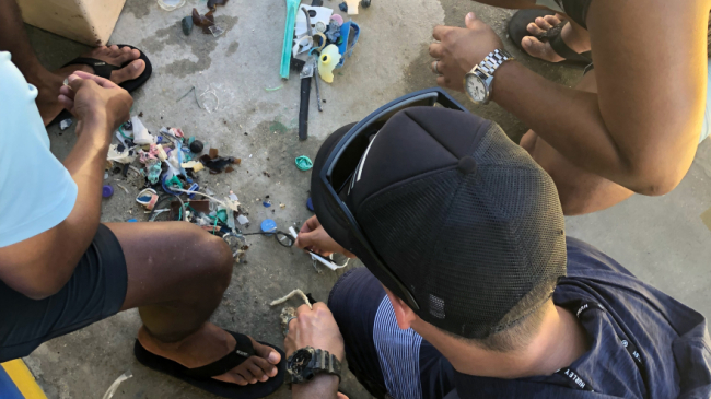 A group of Marine Debris Program Monitoring and Assessment Project participants in the Commonwealth of Northern Mariana Islands learns how to conduct a survey.