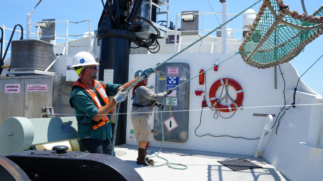 Photo showing professional mariners deploy equipment used for shark research on NOAA Ship Oregon II. CREDIT: NOAA Marine and Aviation Operations/ENS Justin Weeks.