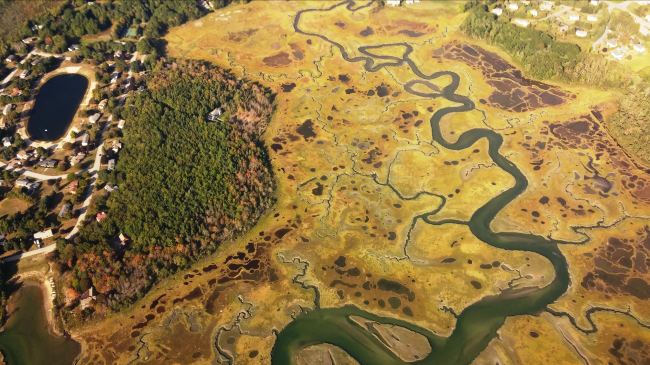 Aerial view showing restoration and conservation project planning in Maine’s Scarborough Marsh — one of the coastal zone management projects recommended for funding under the Bipartisan Infrastructure Law — will improve public access and protect areas for marsh migration. Credit: Scarborough Land Trust.