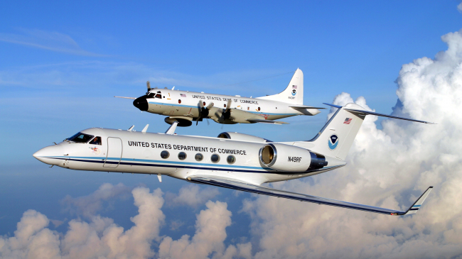 NOAA hurricane hunter WP-3D Orion and Gulfstream IV aircraft in flight.