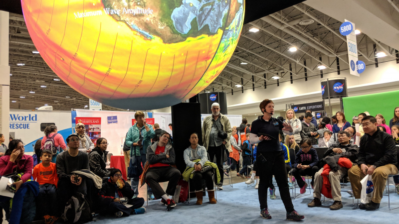 Carrie McDougall with NOAA's Office of Education presents on Science On a Sphere at the USA Science and Engineering Festival in Washington, DC. 