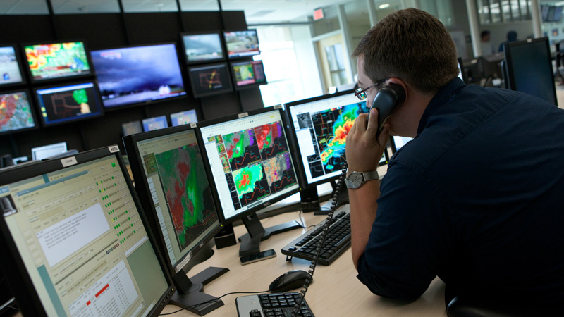 A National Weather Service forecaster provides warnings for his community during a 2013 tornado outbreak. 