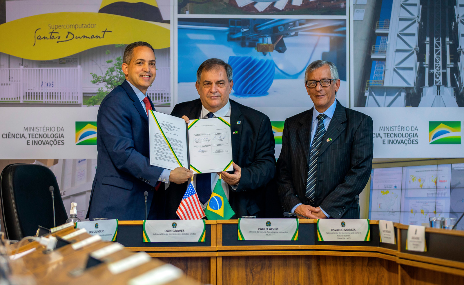 Representatives holding signed NOAA-CEMADEN Agreement
