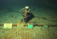 Undersea photograph of a steering mechanism that held the ship’s wheel.
