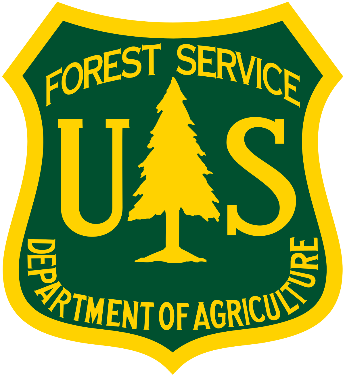 U.S. Forest Service emblem - a yellow shield with a greed field depicting at the top, FOREST SERVICE; in the center, the letter 'U', an silhouette of a tree, and the letter 'S'; at the bottom DEPARTMENT OF AGRICULTURE wrapping around the bottom of the shield shape
