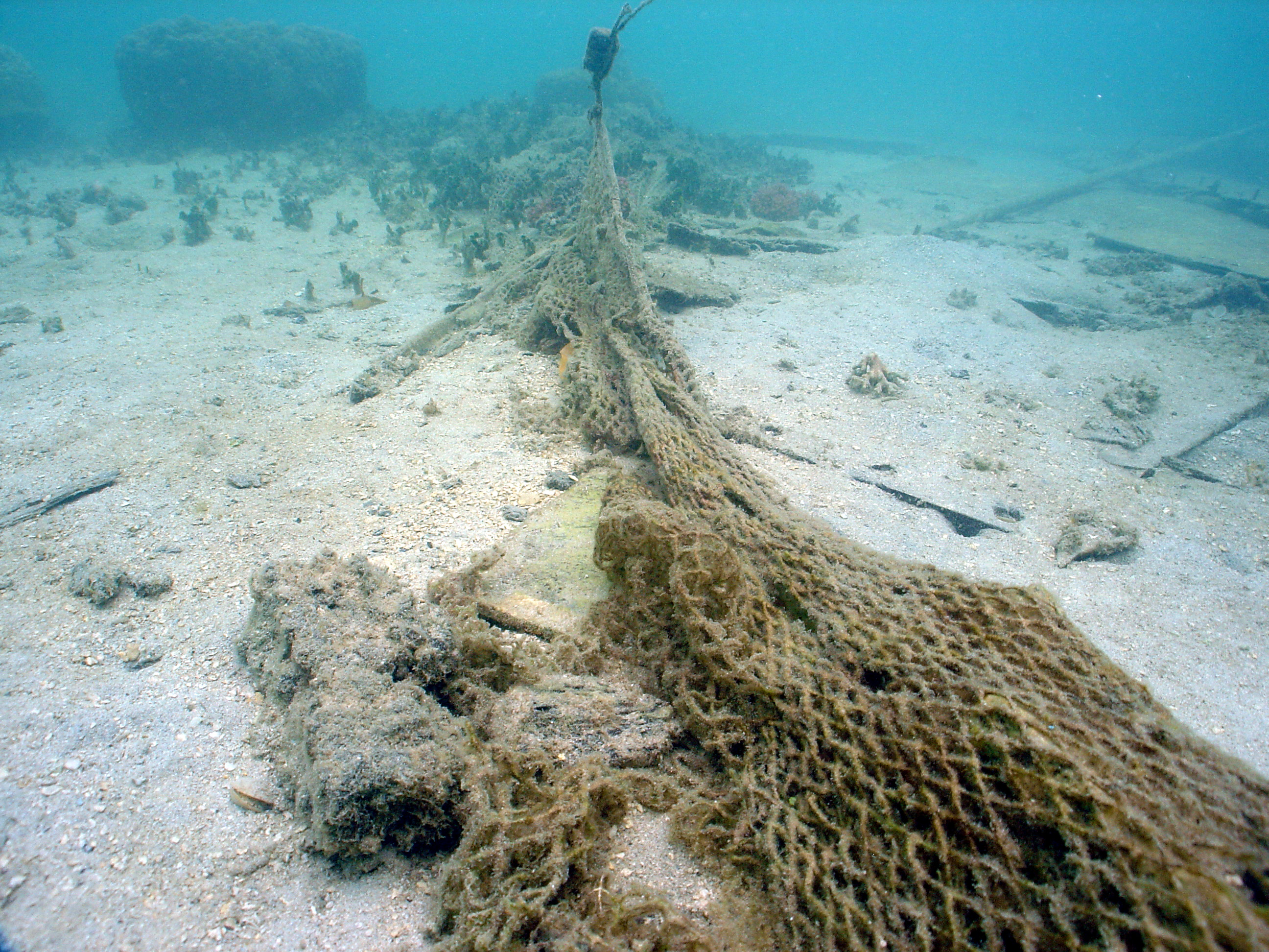 Fishing nets snagged debris from a sunken vessel: Saipan, Commonwealth of the Northern Mariana Islands.