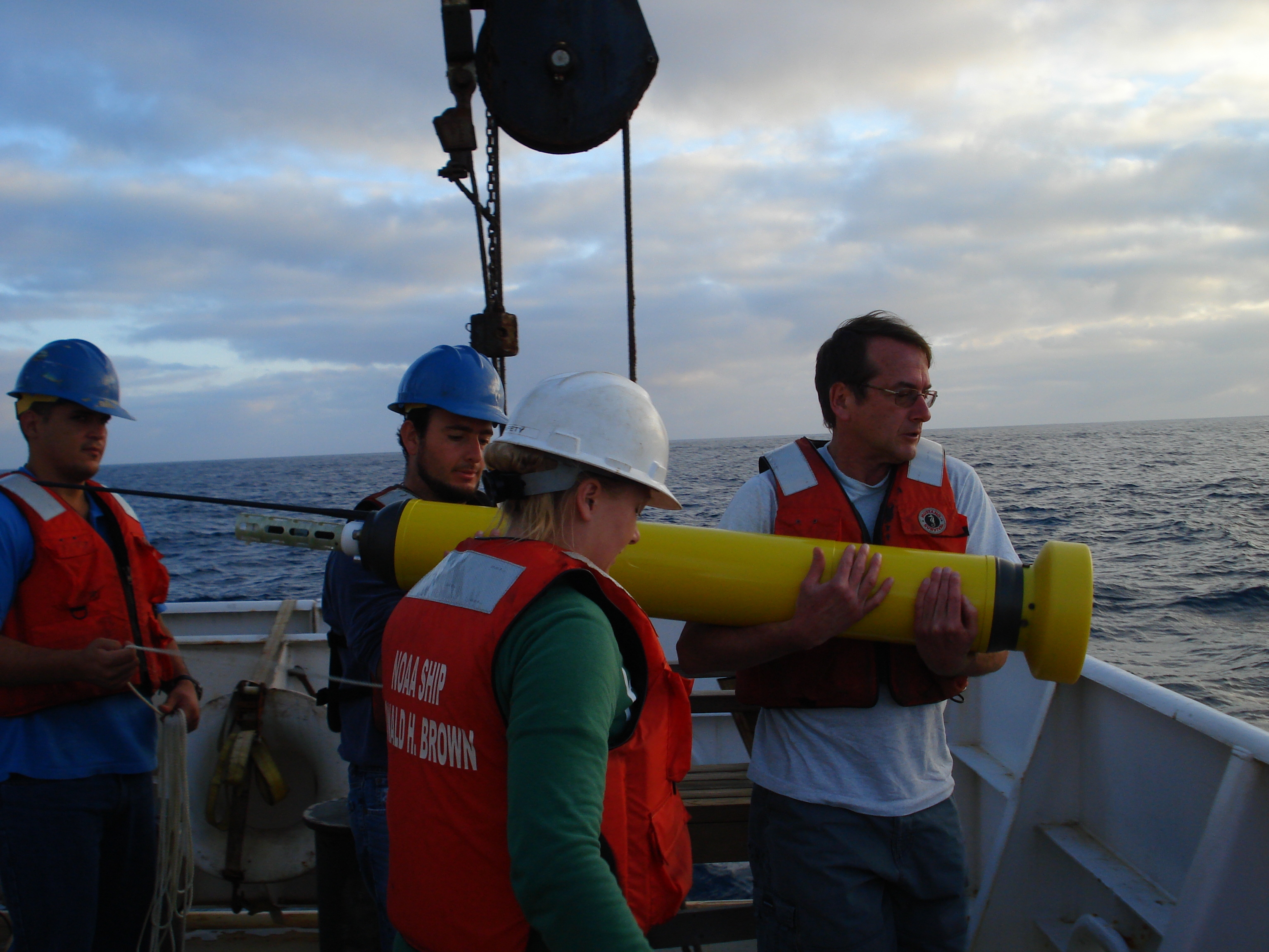 Image showing a NOAA crew deploying an Argo float, which provides real-time climate data about the ocean.