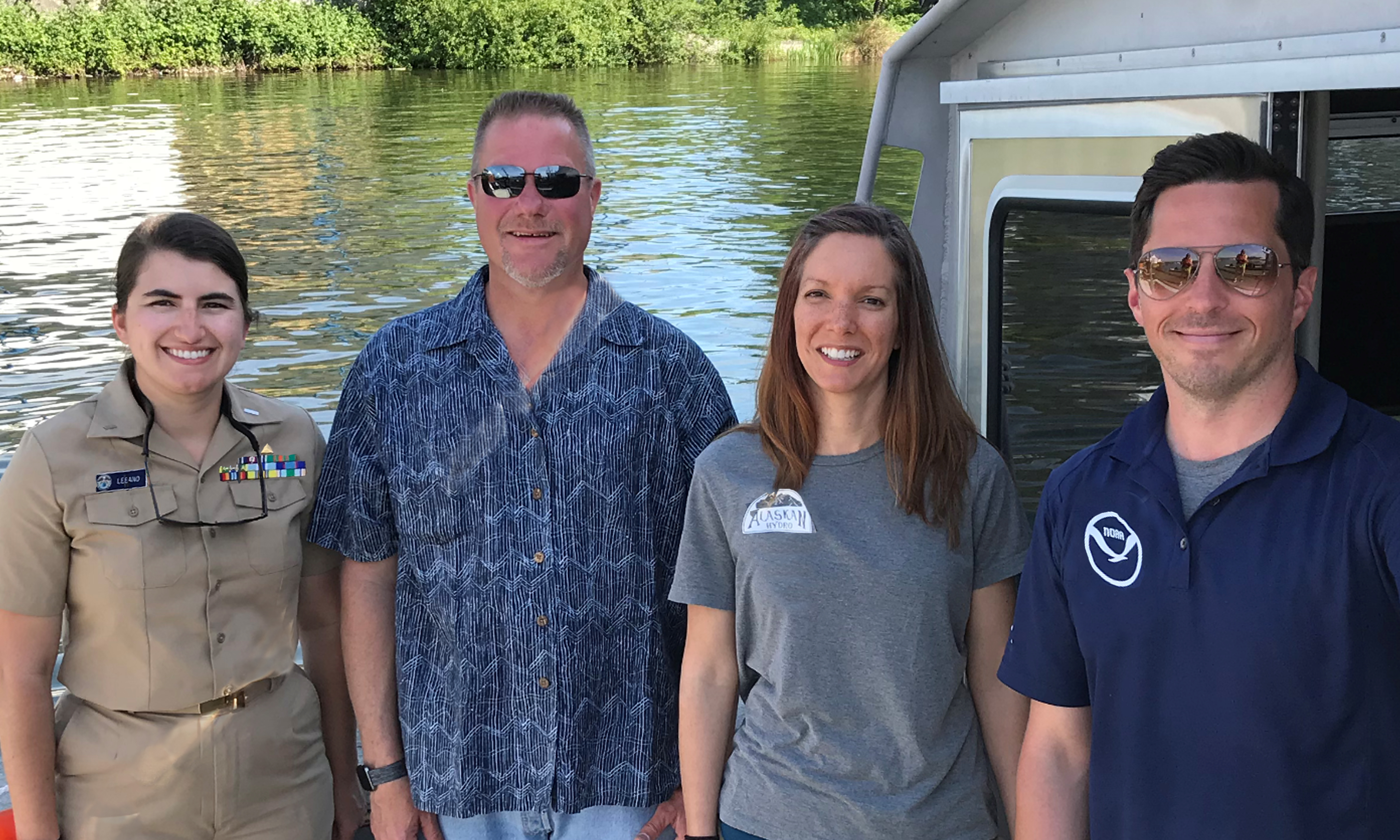 (from left) Lt. j.g. Michelle Levano, Officer-in-Charge, NRT, Seattle; Colin Stewart and Jessica Murphy, NOAA Pacific Hydrographic Branch scientists; and Timothy Wilkinson, NRT, Seattle.