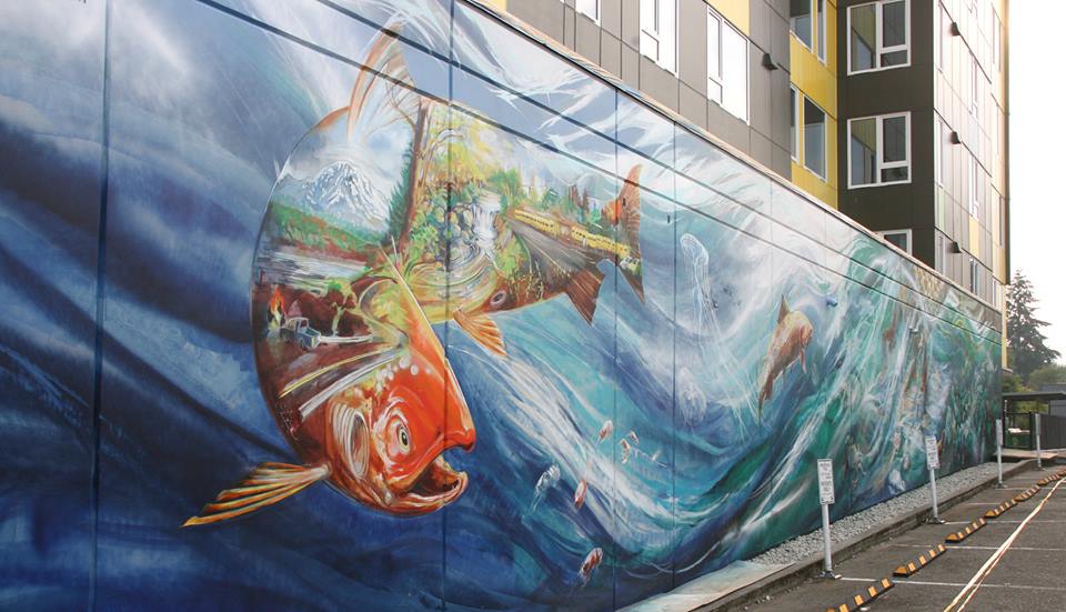 The new 14-by-85-foot community salmon mural was created in Seattle by artist Esteban Camacho Steffensen.