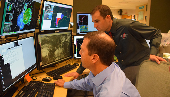 NHC senior hurricane specialist Dan Brown and branch chief Dr. Mike Brennan.