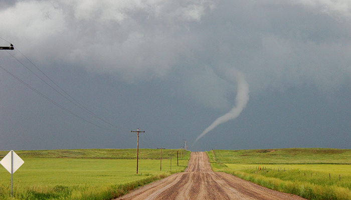 Looking north, researchers watch this tornado near Bushnell, Nebraska, on June 12 move from the east side of the road to the west. This is unusual because most tornadoes track west to east. It was the last day - and the best day - of the research team’s three-week long, 10,000 mile road trip through eight states. Instruments on their trucks measured wind speed and direction, temperature, pressure and dew point every second, adding up to about 35,000 points of data each day.
