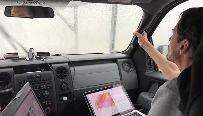 Erik Rasmussen holds on tight as the research truck heads into white-out conditions from heavy rain, strong winds and large hail near Lubbock, Texas, to get measurements in an area of a storm researchers previously avoided. As project coordinator, he monitors radar and other sensors while organizing project participants. Project partners include Penn State University, Texas Tech University, University of Colorado, and University of Nebraska-Lincoln.
