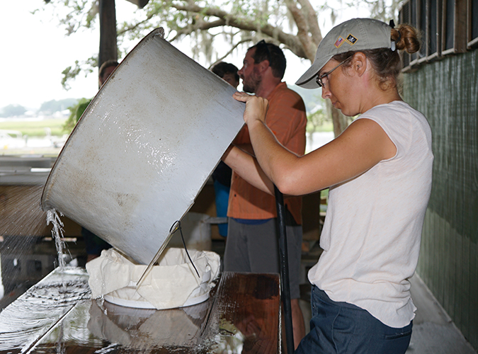 Julie Davis, S.C. Sea Grant Consortium, provides technical assistance to Frank Roberts, owner and founder of Lady Island Oysters. Frank Roberts provides oyster seed to oyster growers in S.C. to maintain oyster aquaculture operations in the state.