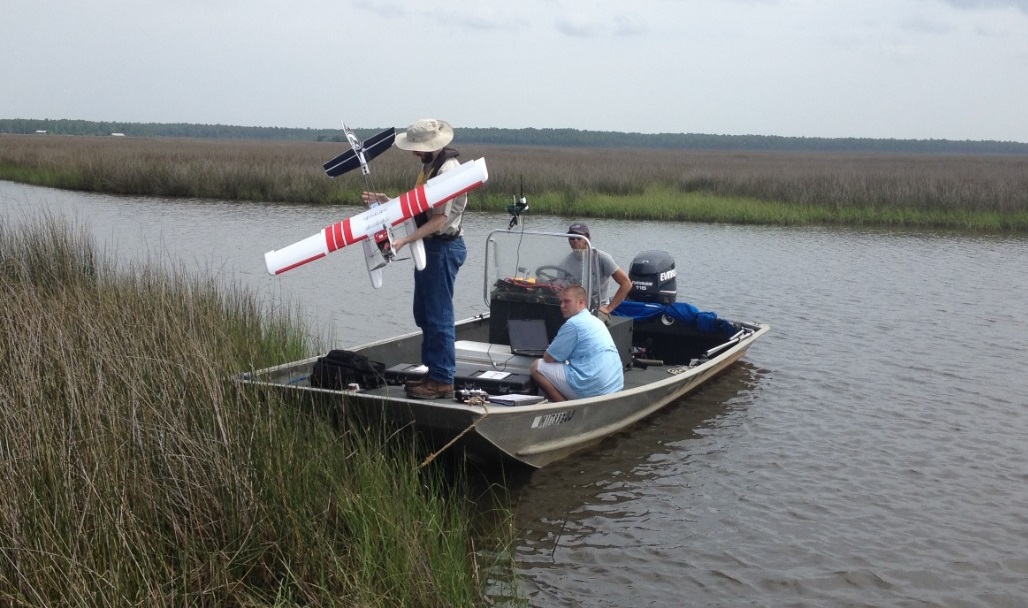 NOAA-funded scientists at Northern Gulf Institute release an unmanned aircraft to map wetlands in Mississippi.