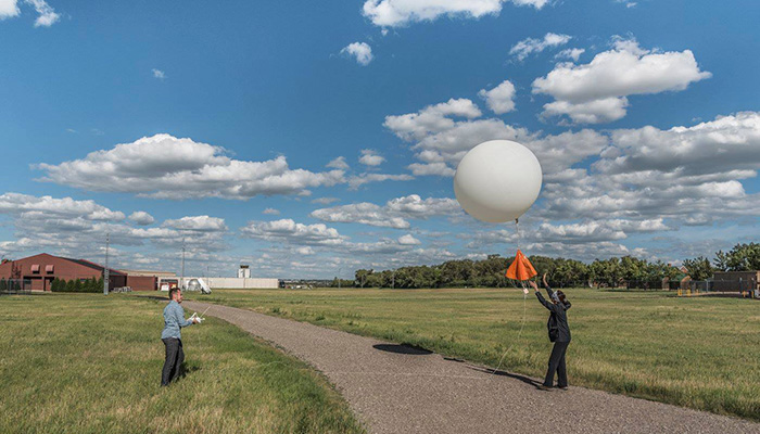 A NWS weather balloon fitted with a radiosonde launches in Bismarck, North Dakota, on June 24, 2017.