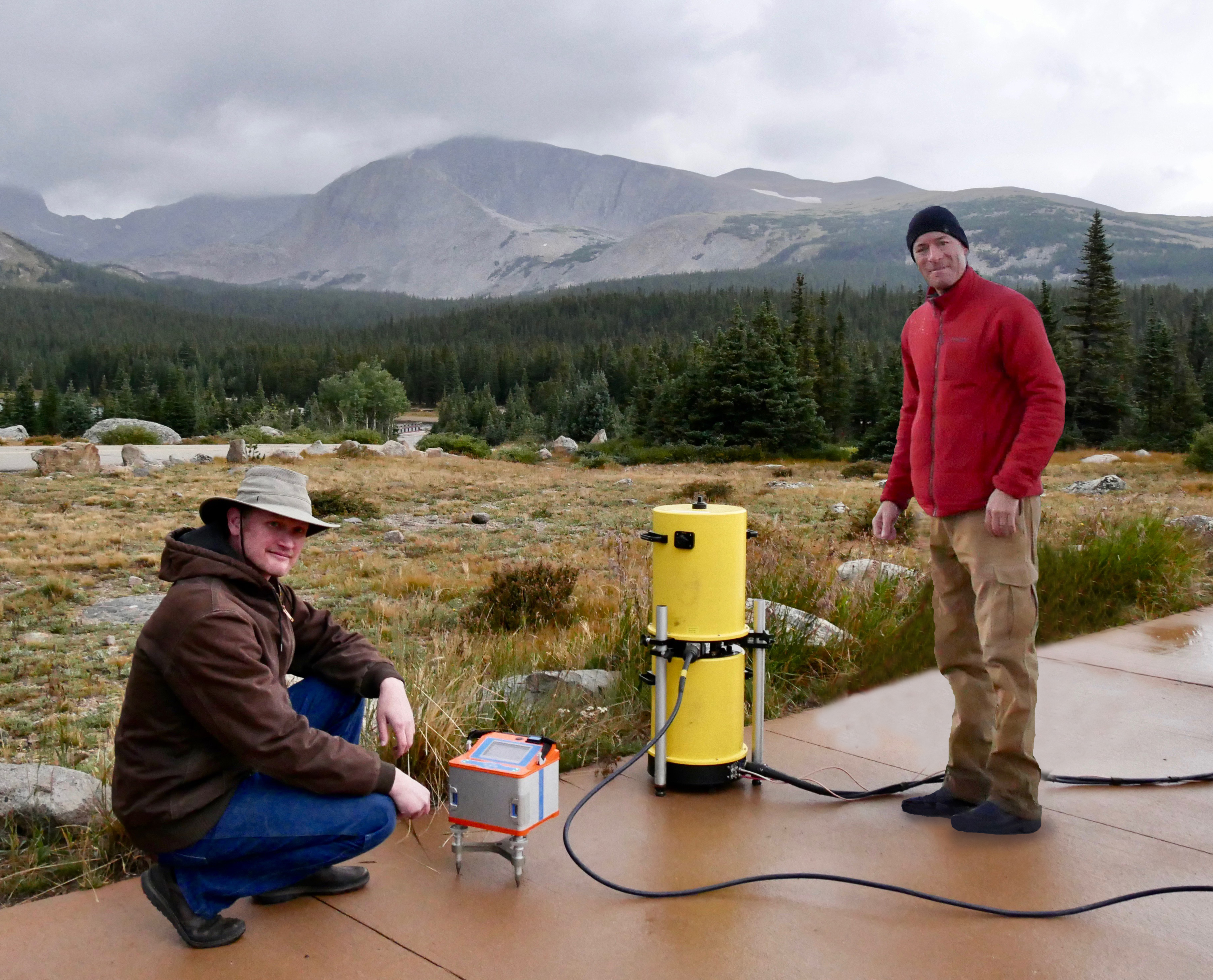 Jeff Kanney (left) and Derek van Westrum prepare to  calibrate gravity meters in the high altitudes west of Boulder. Gravity and height are critical to mapping where water will flow.