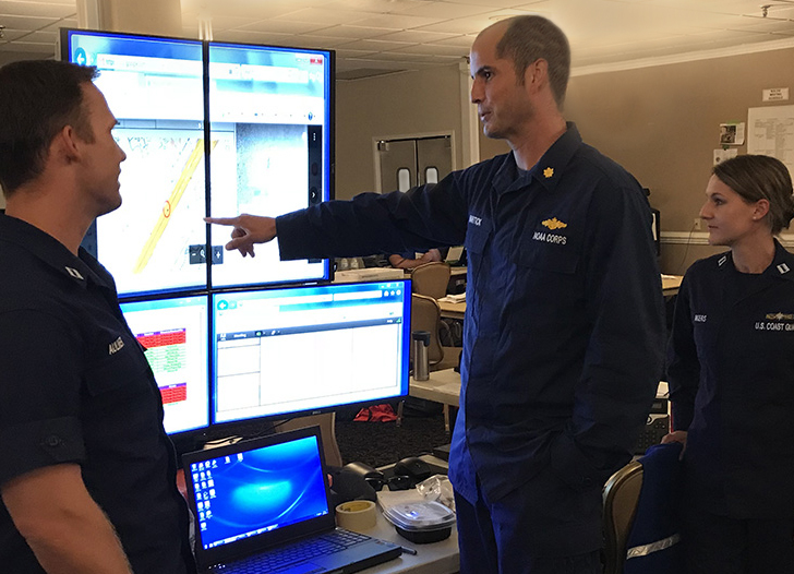 Lt. Cmdr. Ryan Wartick, NOAA Coast Survey navigation manager embedded with the Coast Guard, briefed Coast Guard personnel about NOAA surveys and data analyses following Hurricane Florence's devastation in  North Carolina on Sept. 14, 2018. Because hazardous port obstructions were charted in record time, ports were able to reopen safely and quickly. Surveys were conducted and charts published in under 24 hours, an unprecedented accomplishment underscoring Coast Survey's streamlining efforts over the past