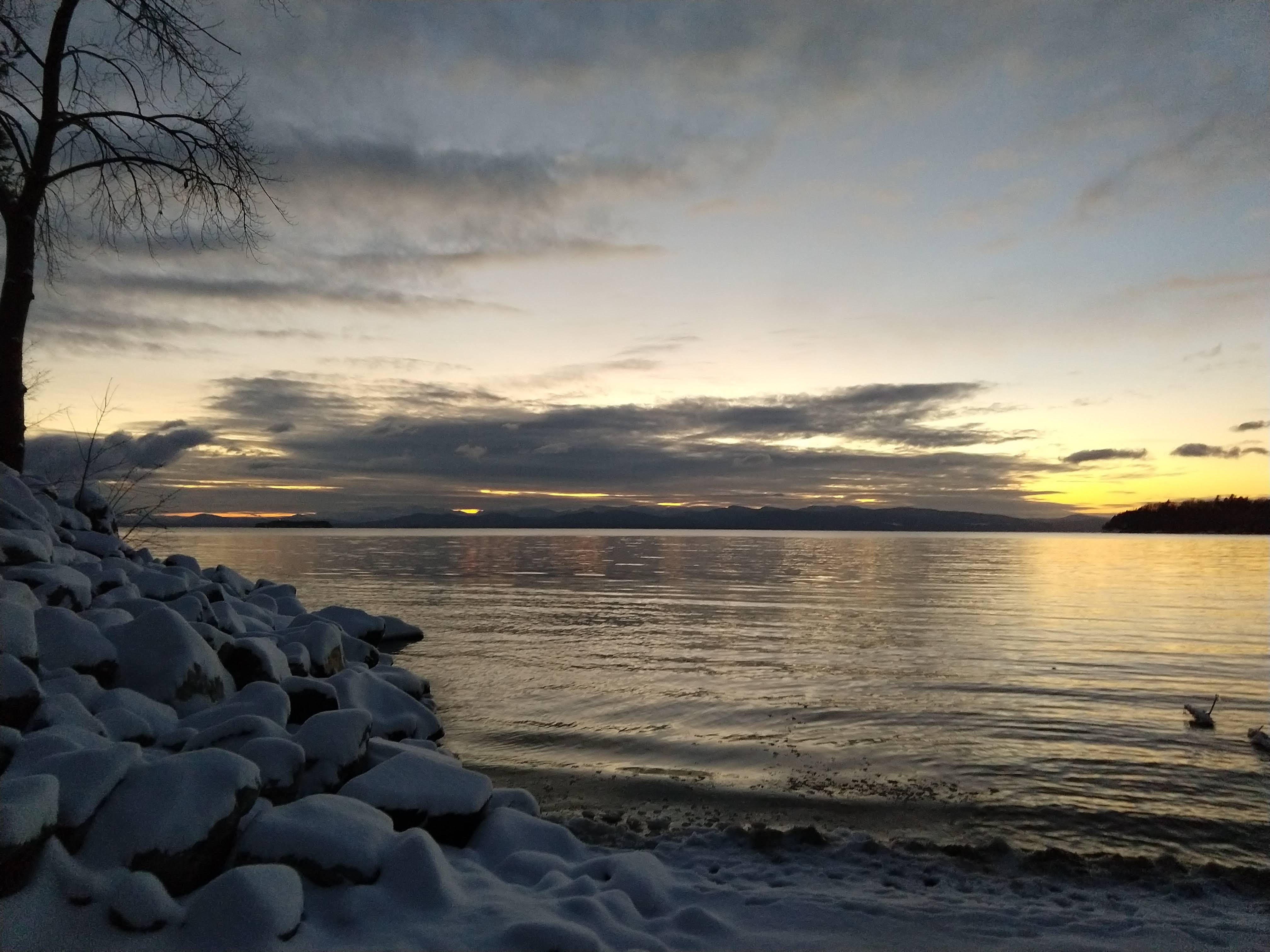 A photo of the location of the sun a few days before the winter solstice at 4:45pm over Lake Champlain in Burlington, Vermont.