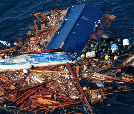 Debris from the March 2011 tsunami in Japan floats off the Sendai coast. 