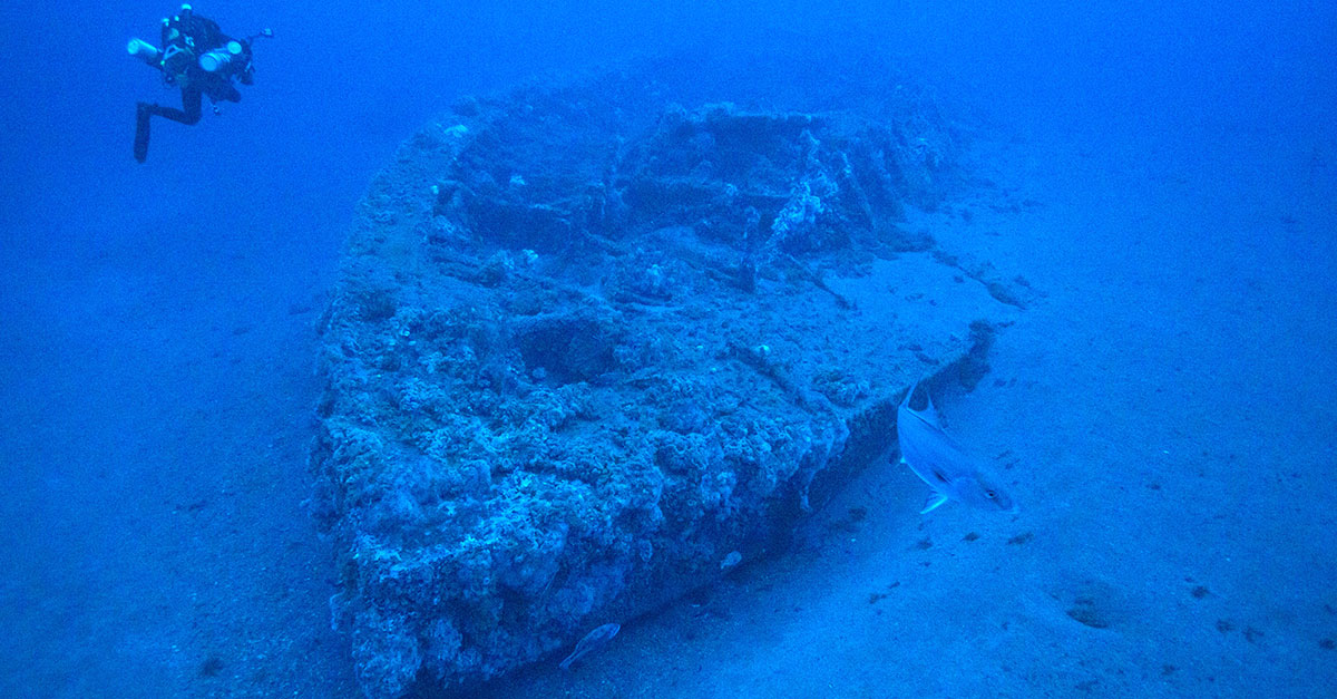 A diver swims by the shipwreck of the famed Civil War ironclad, USS Monitor.