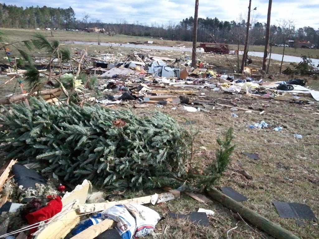 On Christmas Day 2012, tornadoes tore across the U.S. South, destroying properties across several counties in the state of Mississippi. You can see the remains of a Christmas tree strewn on the ground on the site of a destroyed home.