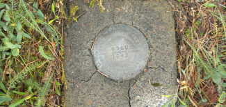 The GPS on Benchmarks project encourages people to visit the bench mark of their choice, such as the one shown here, collect GPS observations and send the information to NOAA. 