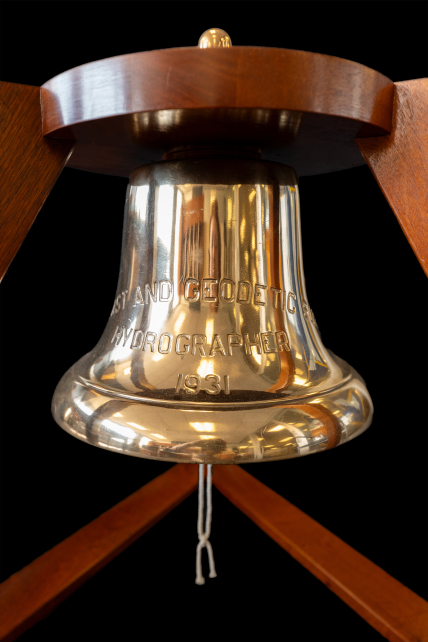 Close-up photo of the USC&GSS Hydrographer’s bell, bearing the inscription, “COAST AND GEODETIC SURVEY, HYDROGRAPHER, 1931.”