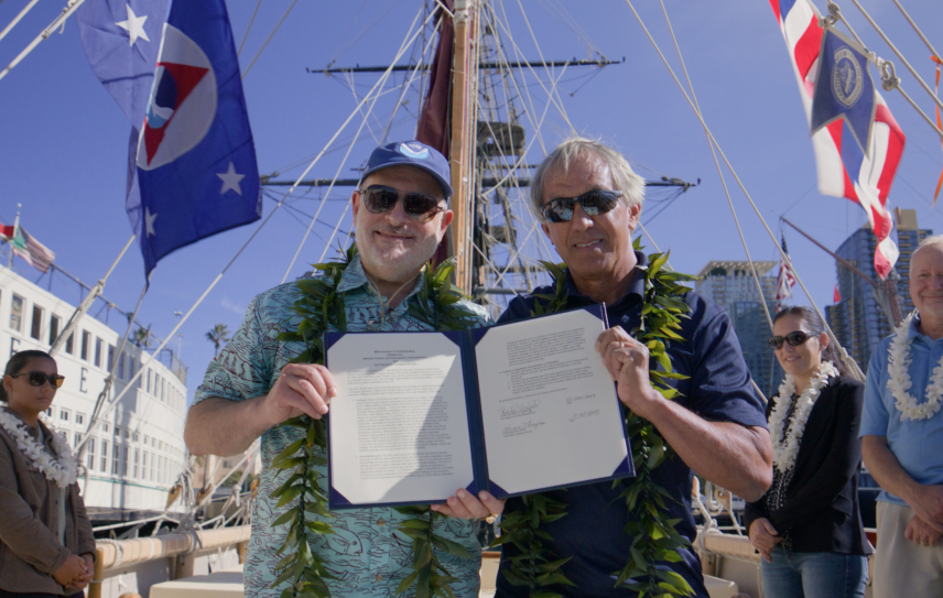 Photo showing NOAA Administrator Rick Spinrad, Ph.D., and Polynesian Voyaging Society CEO Nainoa Thompson after signing the MOU in San Diego, California, aboard Hōkūle‘a. Credit: Ryan Miyamoto