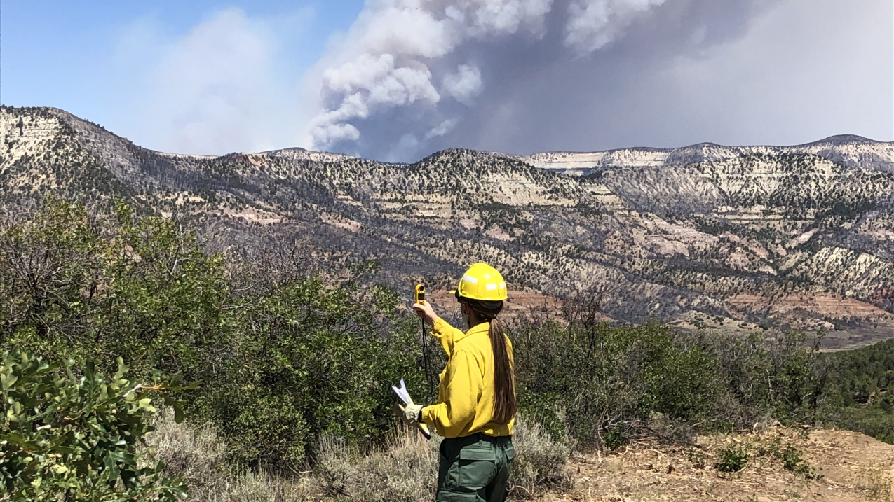 NWS Incident Meteorologist Lisa Kriederman gathers weather observations to support wildfire suppression at the Pine Gulch Fire north of Grand Junction, CO, August 2020.