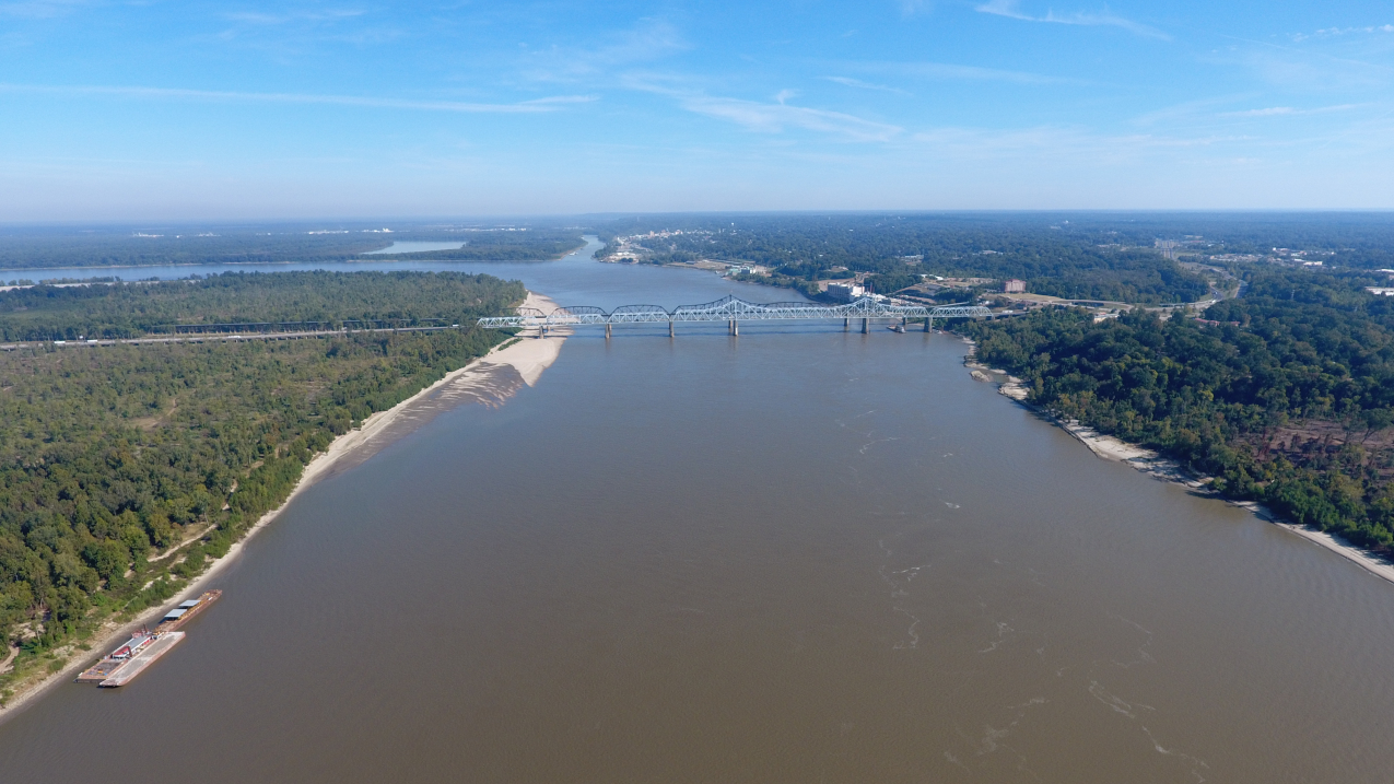 An aerial drone photo of the Mississippi River near Vicksburg, MS, looking Northeast at the I-20 bridge, the confluence of the Yazoo River is in the foreground.