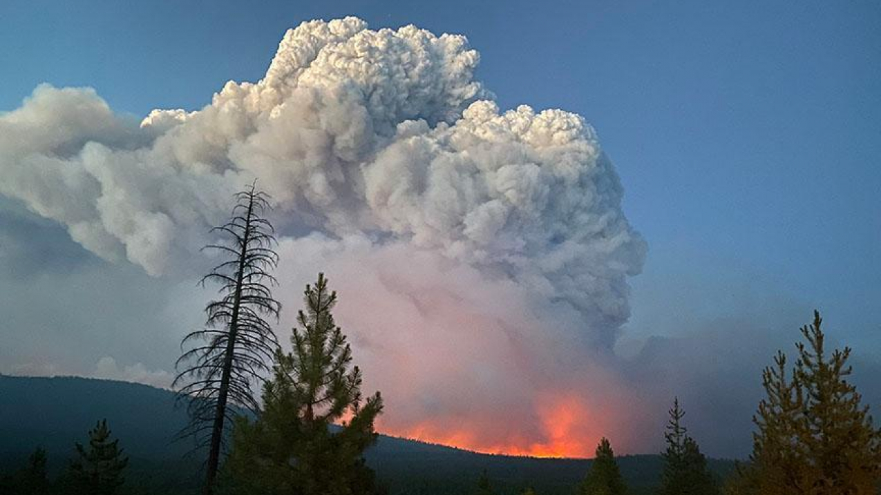 A fire cloud over the ridgeline rising from the Bootleg wildfire in Oregon, July 7, 2021.