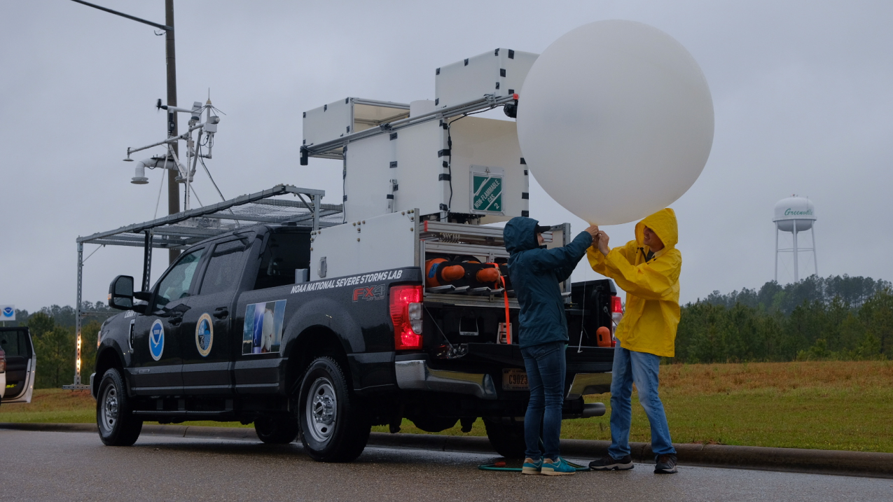 Photo showing researchers preparing to launch an experimental weather balloon on April 5, 2022, near a storm in Greenville, Alabama.