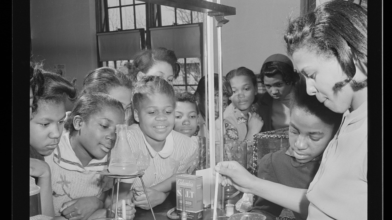 MARCH, 1942: Students participate in a science experiment at a school in Washington, D.C.