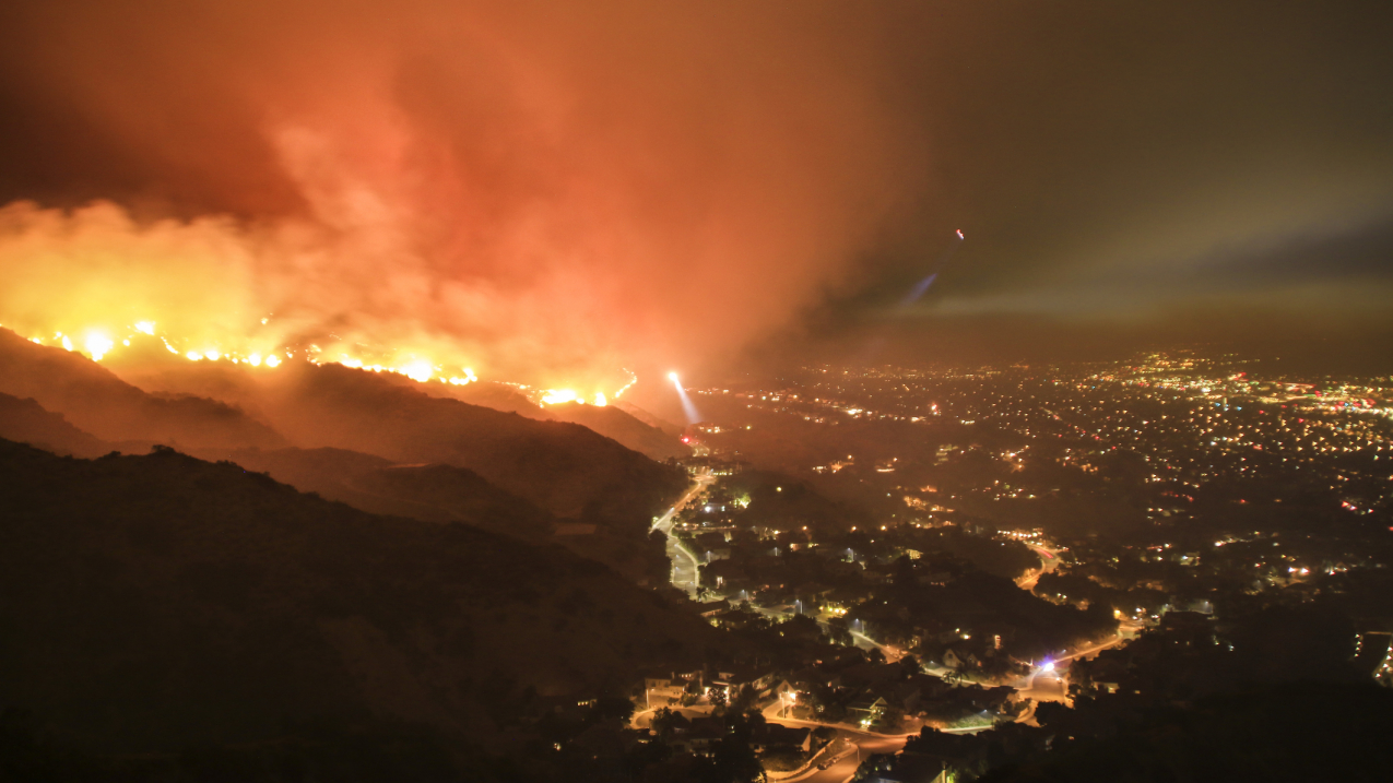 Wildfires and heavy rains are specific types of weather events that can be made more extreme by climate change, say scientists in research published December 2019 in a special edition of the Bulletin of the American Meteorological Society. In this photo, a wildfire rages in the hills of the Los Angeles area. (2017 stock image.)