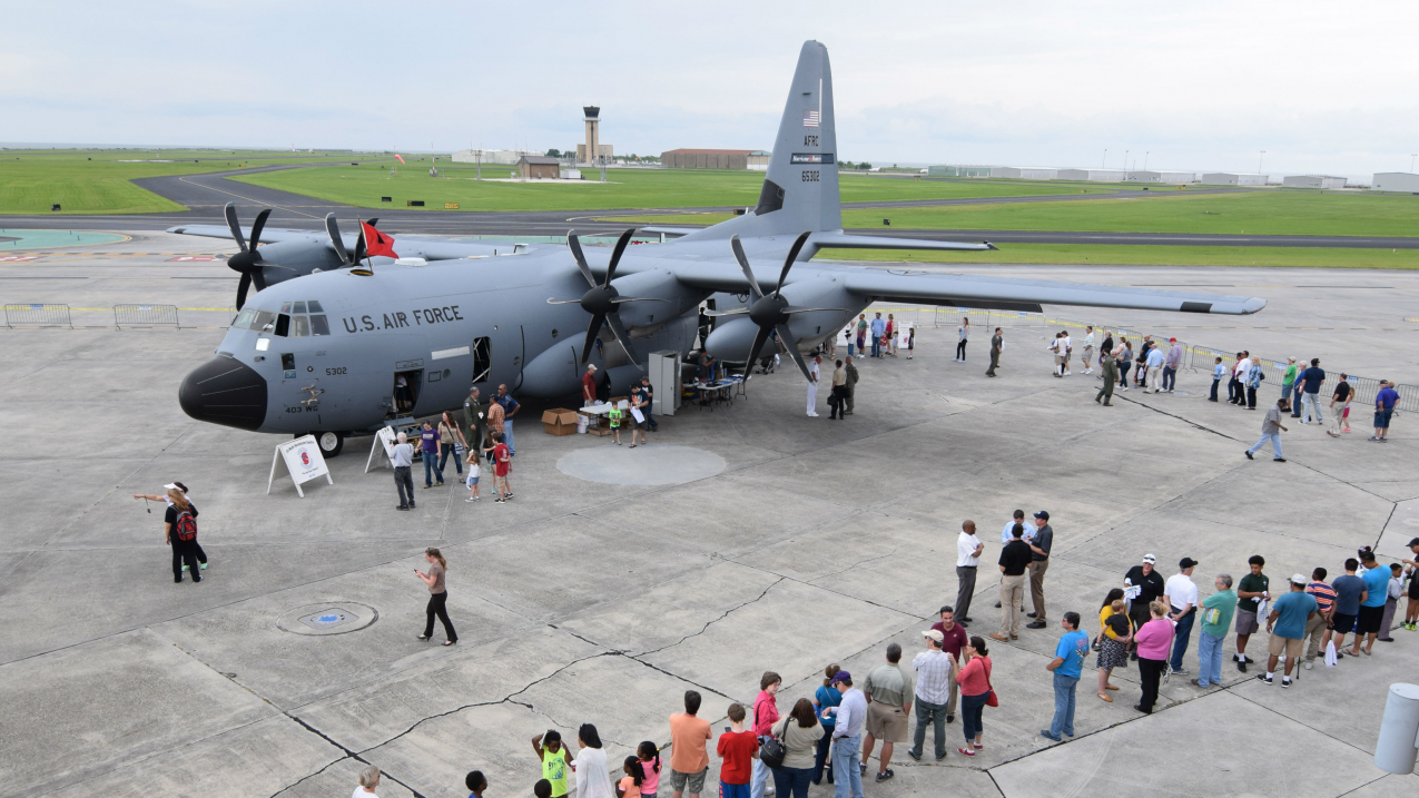Visitors line up for tours aboard the U.S. Air Force WC-130J in Galveston, Texas, on May 18, 2016.