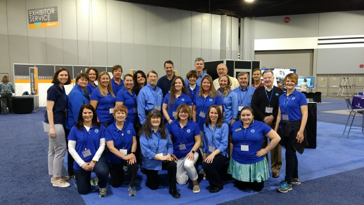 NOAA staff and partners assemble at the NOAA Booth before the 2018 National Science Teachers Association conference. 