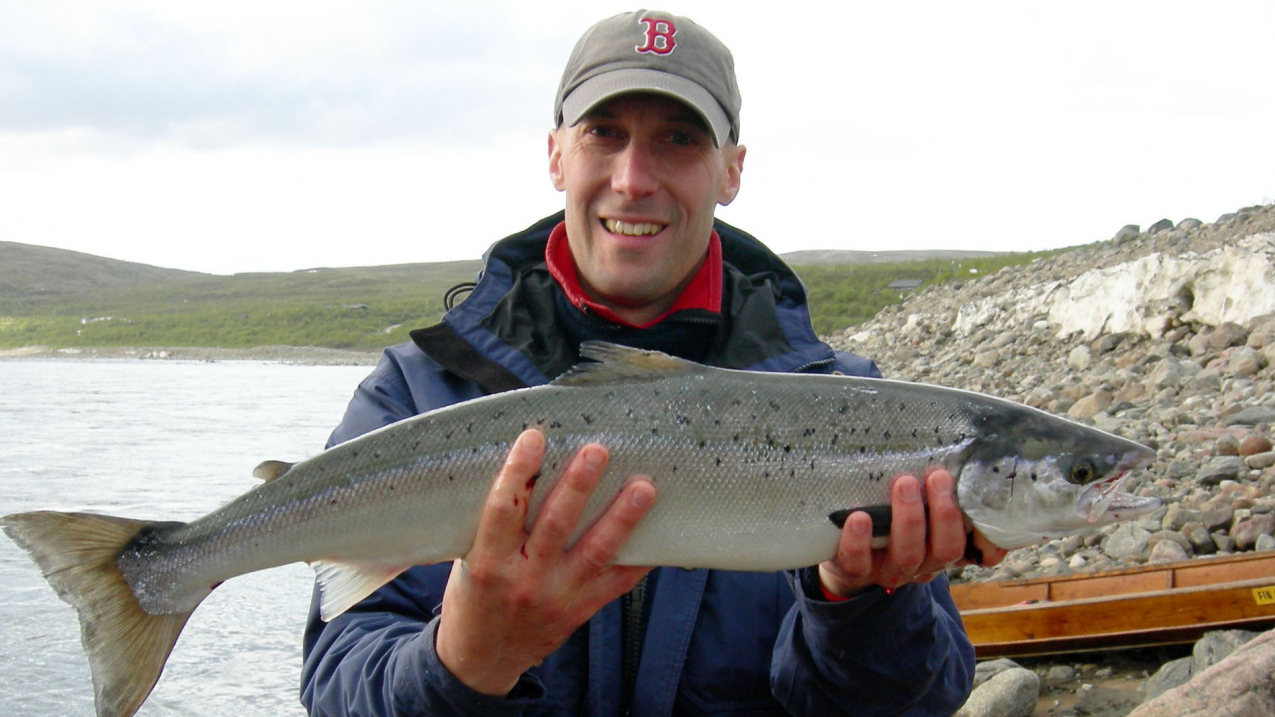 Northeast Fisheries Science Center scientist Tim Sheehan holds an Atlantic salmon.