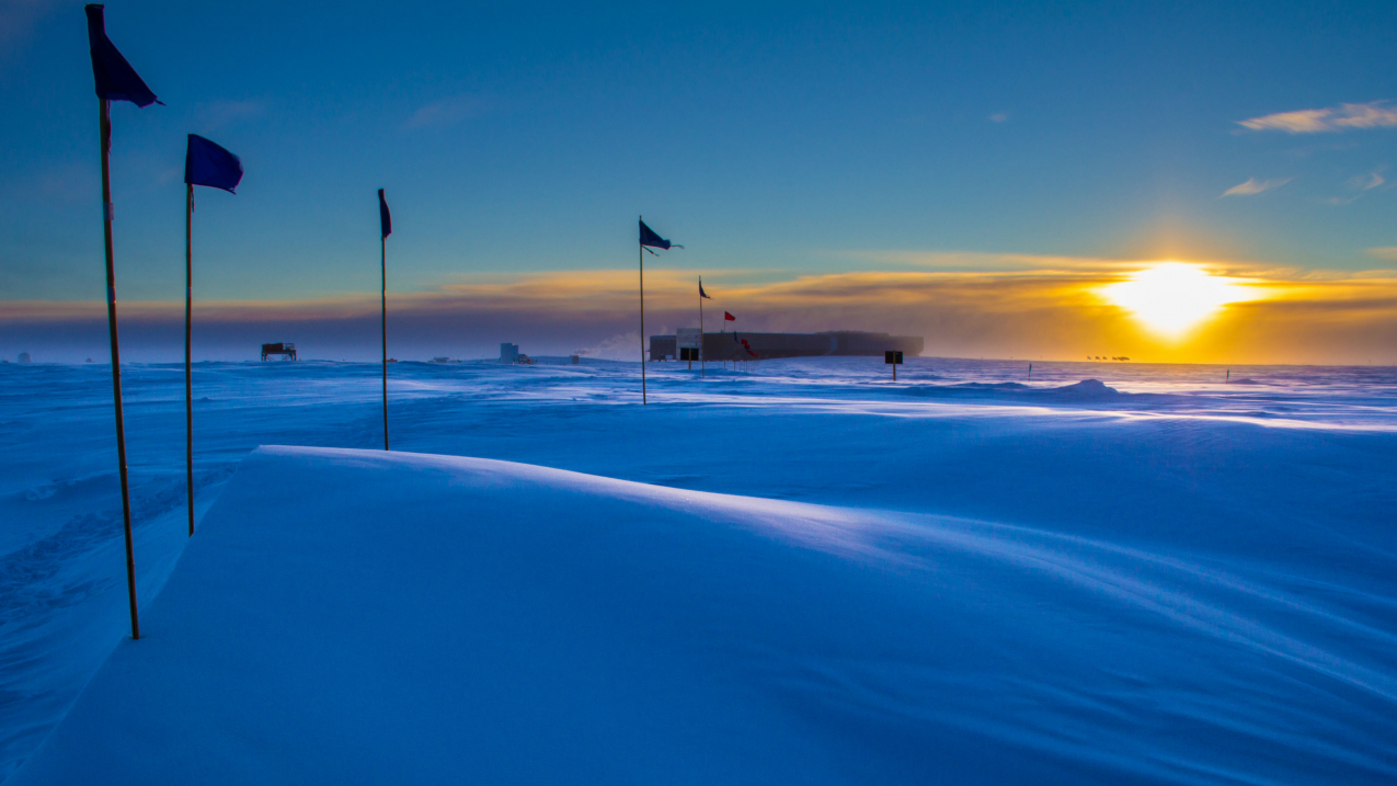 The National Science Foundation’s Atmospheric Research Observatory illuminated by the sun approaching South Pole sunset in 2014.