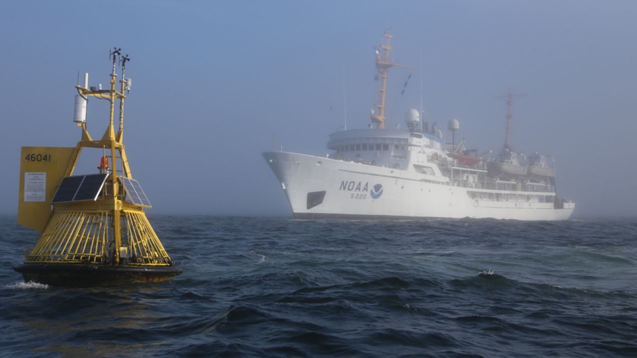 Buoys such as this one off the coast of Washington state collect important information about ocean acidification. In the background is the NOAA Ship Fairweather, which is not participating in the cruise, but did so in the past. The 2016 mission will be conducted by scientists aboard the NOAA Ship Ronald H. Brown.