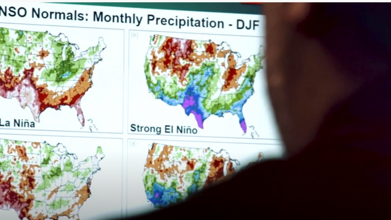 NOAA physical scientist Anthony Arguez reviews El Niño and La Niña winter precipitation Climate Normals on a computer screen at NOAA's National Centers for Environmental Information.