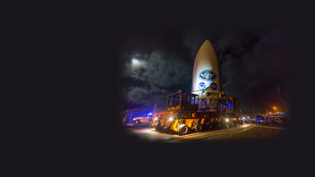 The payload fairing containing NOAA’s GOES-T satellite, secured on a transporter, travels to the United Launch Alliance (ULA) Vertical Integration Facility at Space Launch Complex 41 at Cape Canaveral Air Force Station in Florida. The fairing-encapsulated GOES-T spacecraft was mated with the launch vehicle on Feb. 17, 2022.