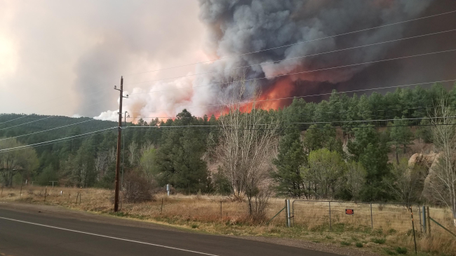 Wildfire activity associated with the New Mexico Hermits Peak Fire on the evening of April 29, 2022, off of Highway 518. 