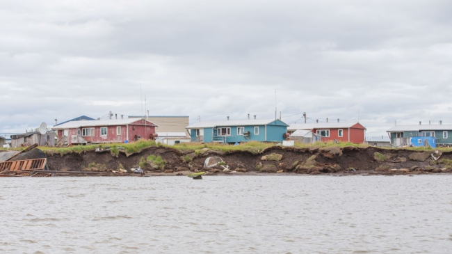 Houses on the water impacted by erosion.